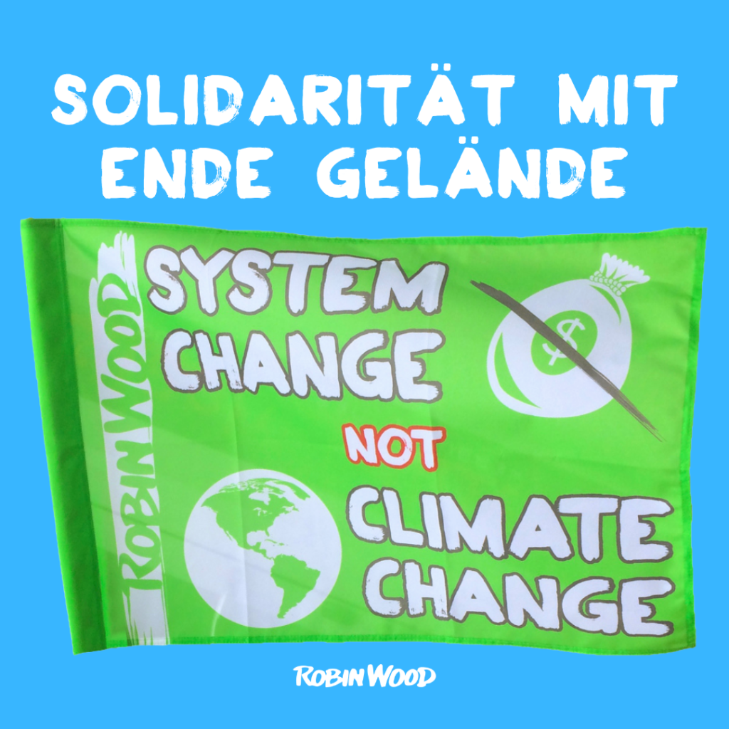 Solidarität mit Ende Gelände. Fahne System change not climate change