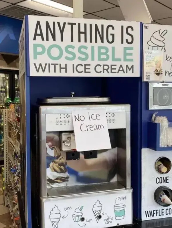 Ice Cream machine saying "Anything is possible with ice cream", sporting a hand-written sign that says "no ice cream"