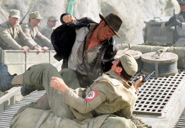 Indiana Jones, punching a Nazi on a tank.